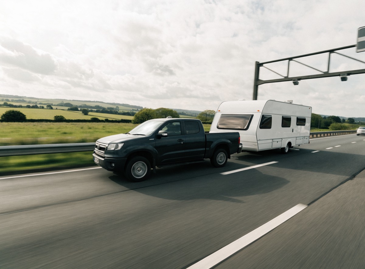 Caravan transporter on a UK motorway heading out to a collection